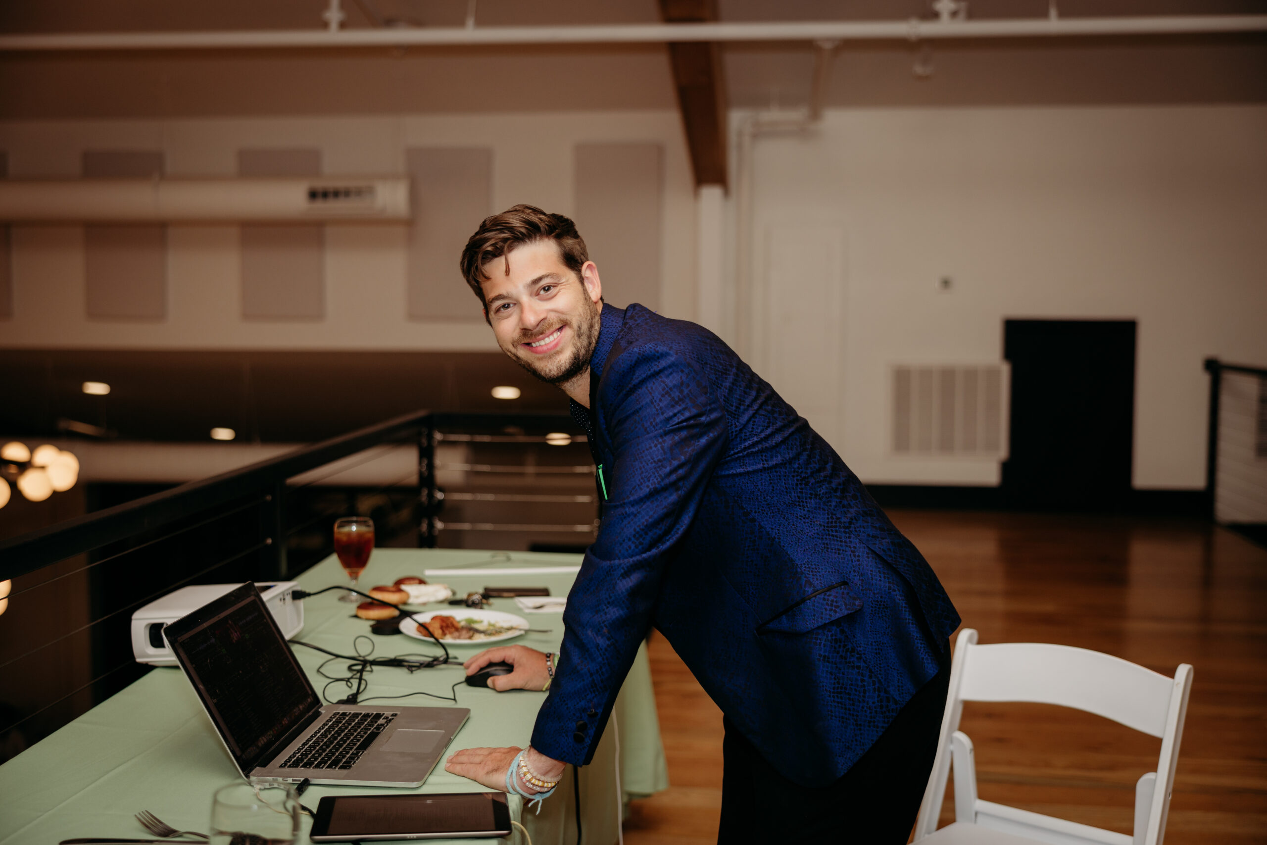 Benji at the control table in a blue jacket